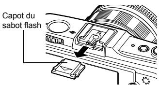 OLYMPUS E-P1 - Retirez le capot du sabot flash en le faisant glisser dans le sens indiqué par la flèche sur l'illustration. - 1