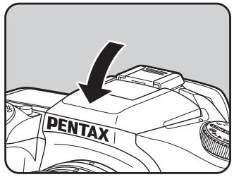 PENTAX ISTDS2 - Appuyez sur la partie indiquée sur l'illustration pour rétracter le flash. - 1