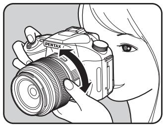 PENTAX K100D - Tournez la bague du zoom vers la droite ou vers la gauche. - 1