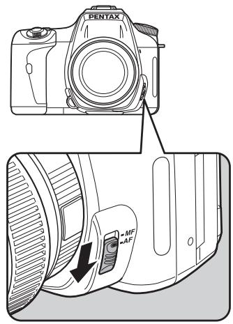 PENTAX K100D - Réglez le curseur du mode de mise au point sur AF. - 1