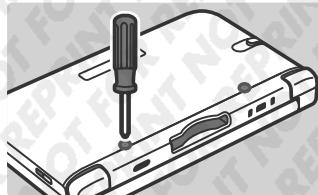 NINTENDO 3DS XL - Dévissez le couvercle de la batterie. - 1