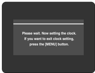 Please wait. Now setting the clock. If you want to exit clock setting, press the [MENU] button.