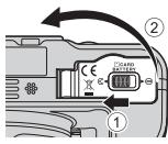 NIKON COOLPIX P900 - Insertion de l'accumulateur et de la carte mémoire - 1