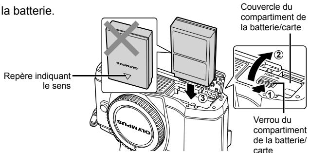 OLYMPUS OM-D E-M10 - Insertion de la batterie. - 1