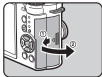 PENTAX QS1 - Faibles glisser la trappe de protection du logement de la carte dans le sens de ①. - 1