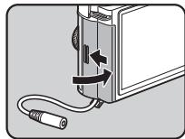 PENTAX QS1 - 3Fermez la trappe de protection. - 2