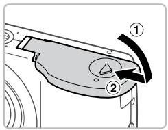 CANON POWERSHOT A2300 - Insérez les piles. - 1