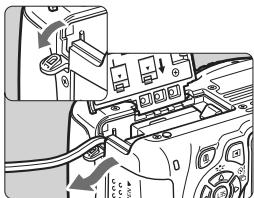 CANON EOS 600D - Insérez le coupleur secteur. - 1