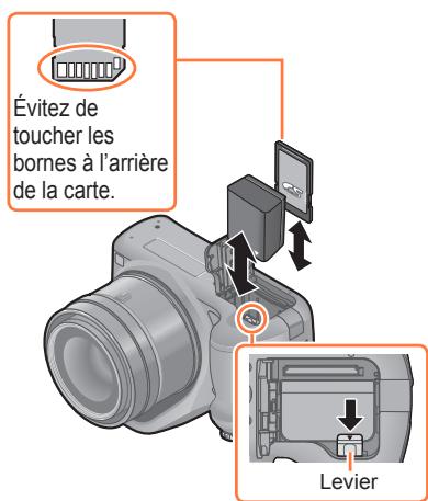 PANASONIC FZ72 - Fermez le couvercle du logement à carte/batterie et glissez le levier de libération sur la position [LOCK]. - 1