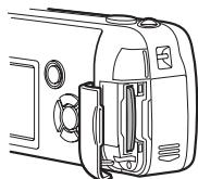 OLIMPUS D575 ZOOM - Face the card the correct way and insert it into the card slot as shown in the illustration. - 2