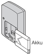 SONY CYBER-SHOT DSC-T110D - Työnnä akku akkulaturiin. - 1