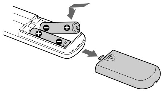 SONY CDP-XE330 - Inserting batteries into the remote - 1