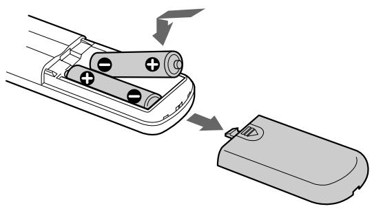 SONY CDP-XE900E - Inserción de pilas en el mando a distancia - 1