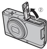 FUJIFILM XF1 - Ouvrez le couvercle du compartment de la batterie. - 2
