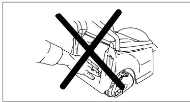 Illustration of a hand holding a device with a black X symbol (no text or symbols present)
