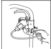 Line drawing of a mechanical clamp or clamp device with hands operating it (no text or symbols)