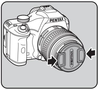 PENTAX K-M - Pour-retirer le bouchon avant de l'objectif, enforcez les parties indiquées sur l'illustration. - 1