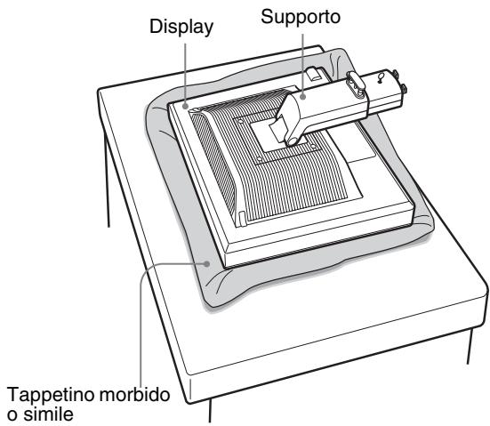 SONY SDM-S95AR - Estrarre il display alla confezione, quindi posizionare il telaio del display lungo il bordo della scrivania. - 1