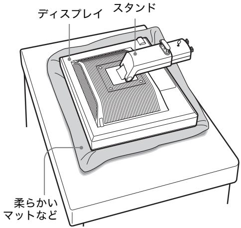 SONY SDM-S95AR - ヨスPLEイ本体を箱から取り出し、マット上の上にデイスPLEイの下端と机の端を捫て置く。 - 1