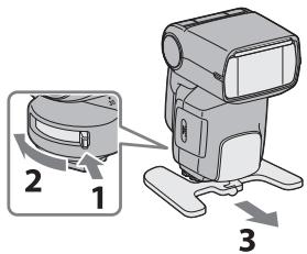 Diagram showing a device with labeled parts and directional arrows indicating motion or assembly steps.