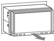 SONY XNV-L77BT TOMTOM - Faites glisser l'appareil en dehors de son support. - 1
