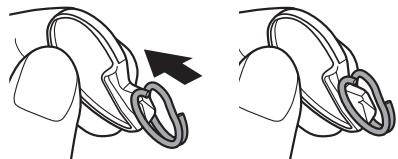 FUJIFILM INSTAX MINI 70 - Open a strap clip. - 1