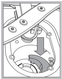 Mechanical assembly diagram showing a rotating component with a downward arrow indicating motion (no text or symbols)