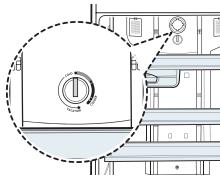 Technical diagram showing a circular component with a dial indicator and labeled parts, likely illustrating a mechanical or electrical assembly.