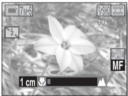 LOGICOM-SANYO XACTI VPC-HD2 - Déplacez le bouton de réglage SET vers la gauche ou la droite pour régler la distance de mise au point et appuyez sur le bouton de réglage SET. - 1