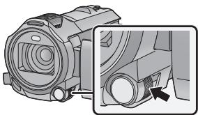 PANASONIC HC-V750 - Poussez la bague manuelle multifonction. - 1