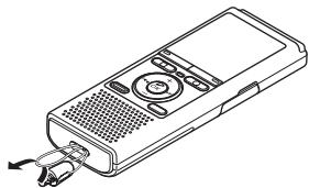 OLYMPUS VN-731PC - Retirez une courroie du câble USB portable. - 2