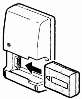 SONY ALPHA A580 - Insert the battery pack onto the battery charger. - 1