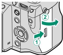 FUJIFILM X-T10 - Open the memory card slot cover. - 2