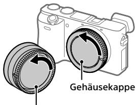 SONY A6500 - Nehmen Sie die Gehäusekappe von der Kamera und die Hintere Objektivkappe von der Rückseite des Objektivs ab. - 1
