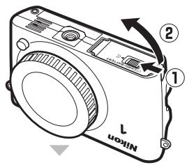 NIKON 1 S2 - Insérez l'accumulateur et une carte mémoire. - 1