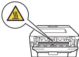 Diagram showing a printer with warning symbol and warning triangle, indicating thermal hazard or hazard.