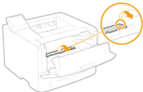CANON LBP251 - Maintenez le bouton vert, puis relevez le guide d'alimentation. - 1