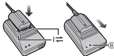 PANASONIC LUMIX DMC-L1K - Alignez la batterie avec les marques situées sur l'adaptateur secteur, puis placez-la directement dans l'adaptateur secteur. Vérifiez qu'elle est bien installée. - 1