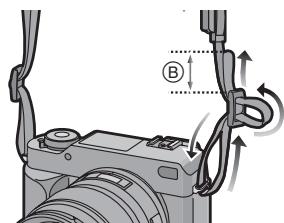 PANASONIC LUMIX DMC-L1K - Passez la bandoulière à travers l'élément coinceur et ajustez la bandoulière. - 1