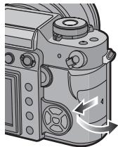PANASONIC LUMIX DMC-L1K - Faites glisser le couvercle du logement de la carte pour l'ouvrir. - 1