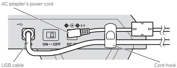 PIONEER DDJ-S1 - Hook the AC adapter's power cord in the top of the cord hook, the USB cable in the bottom. - 1