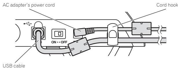 PIONEER DDJ-T1 - Hook the AC adapter's power cord in the top of the cord hook, the USB cable in the bottom. - 1