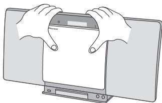 PIONEER X-SMC00-W - À l'aide des deux mains, faites glisser le panneau interchangeable vers le haut pour le déposer. - 1