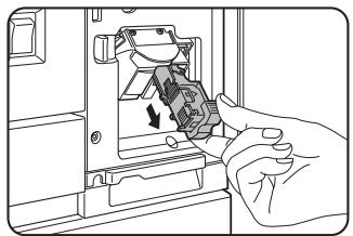 SHARP DM-3551 - Pull the release lever for the staple box and remove the box. - 1
