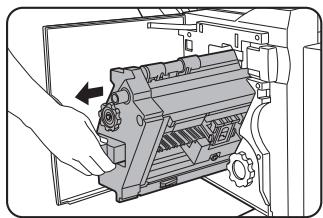 SHARP DM-3551 - Open the front cover and pull out the stapler unit. - 1