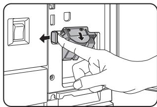 SHARP DM-3551 - While pushing the staple unit release lever to the left, rotate the staple unit to face down. - 1