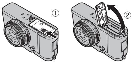 FUJIFILM PREMIUM X100S - Ouvrez le couvercle du compartiment de la batterie. - 1