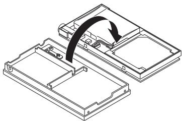JVC XA-HD500S - Separe la placal del compartmento inferior. - 2