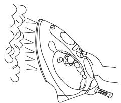 LERVIA KH 2203 STEAM AND DRY IRON - Användning av Ångknappen:när strykjärnet hälls lodrätt - 1