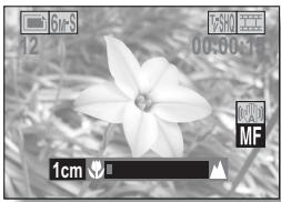 LOGICOM-SANYO XACTI VP-CG65 - Déplacez le bouton de réglage SET vers la droite ou la gauche pour sélectionner la distance de mise au point souhaitée et appuyez sur le bouton de réglage SET. - 1